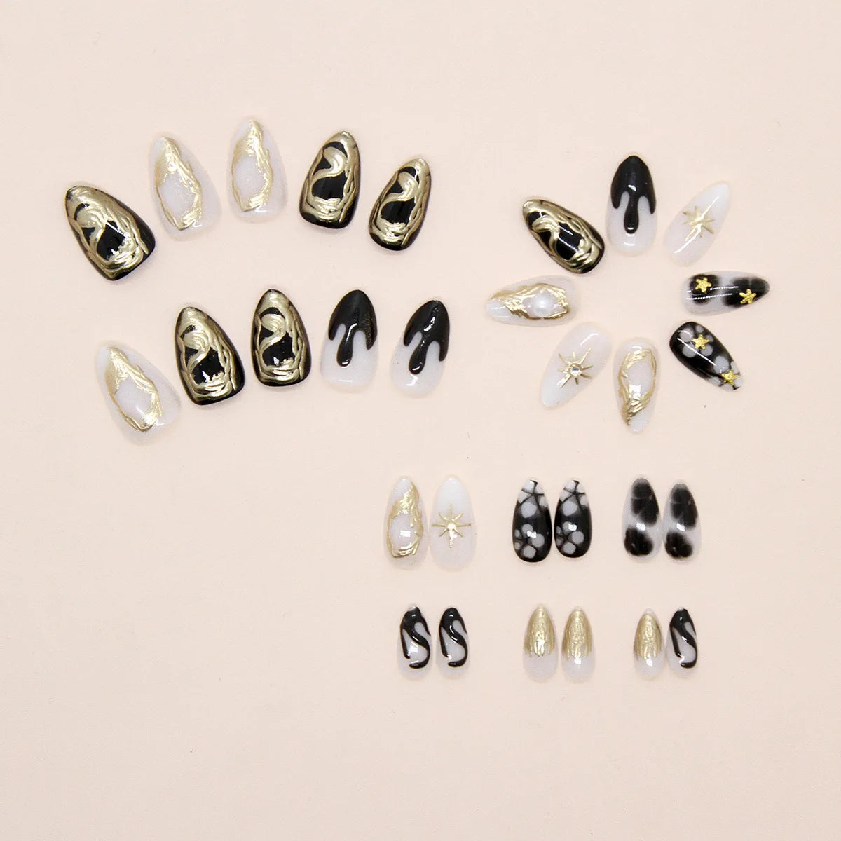 24 uñas postizas góticas de estrella de mar: almendra corta con diseños tribales 3D y estrella con incrustaciones de perlas.